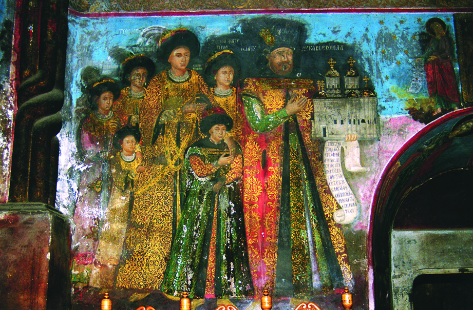 Fotografie - Tabloul votiv - Mănăstirea Cetățuia (Iași)
	Tabloul votiv de la Mănăstirea Cetățuia reprezentând familia Domnului Gheorghe Duca: domnitorul Gheorghe Duca, Doamna Anastasia, Doamna Ecaterina (probabil soacra domnitorului), Constantin Duca (care va domni între anii 1693-1695 și 1700-1703), fiica sa Elena (viitoarea soție a cronicarului Nicolae Costin), fiica sa Maria, alături de un alt copil, al cărui nume nu se poate descifra (se găsește pe peretele vestic al pronaosului bisericii). Ei sunt pictați în costume de ceremonial, brodate cu flori cu fire de aur și cu brandemburguri.
	Pictura de la Cetățuia este o creație artistică deosebită, având ca autori pe Mihai, Gheorghe și Dima din Ianina, alături de pictori autohtoni care lucraseră la Trei Ierarhi. Este ultimul mare ansamblu de pictură murală din Moldova în linia tradițiilor postbizantine. Tabloul votiv -  Mănăstirea Cetățuia (Iași)