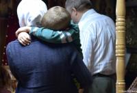 copil în brațele mamei